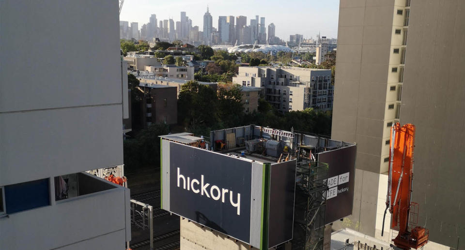 A building site has been erected in front of a renter's apartment which has views of Melbourne.