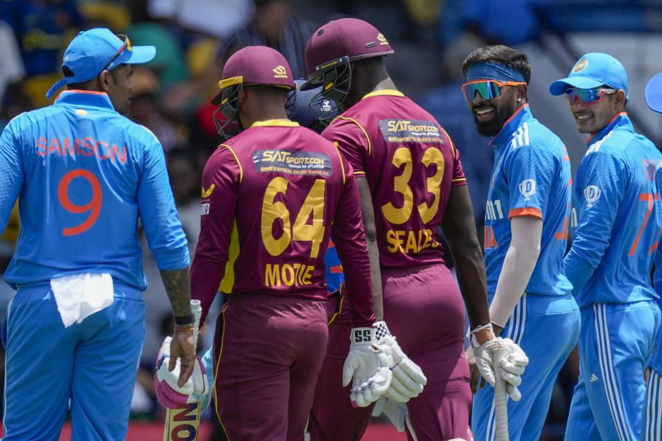 Hardik Pandya smiles as India's team leaves the field for 114 runs after West Indies' innings during their first ODI cricket match at Kensington Oval in Bridgetown, Barbados, Thursday, July 27, 2023. (AP Photo/Ricardo Mazalan)