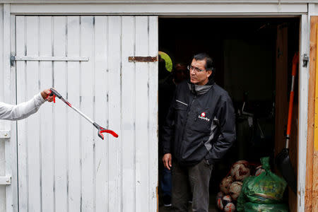 Salim El-Chahabi, an inhabitant of Mjolnerparken, where he works as a youth job coordinator, stands in the doorway of his work shed that he dubs "The White House" as he assigns duties in the Mjolnerparken area of Copenhagen, Denmark, April 30, 2018. REUTERS/Andrew Kelly