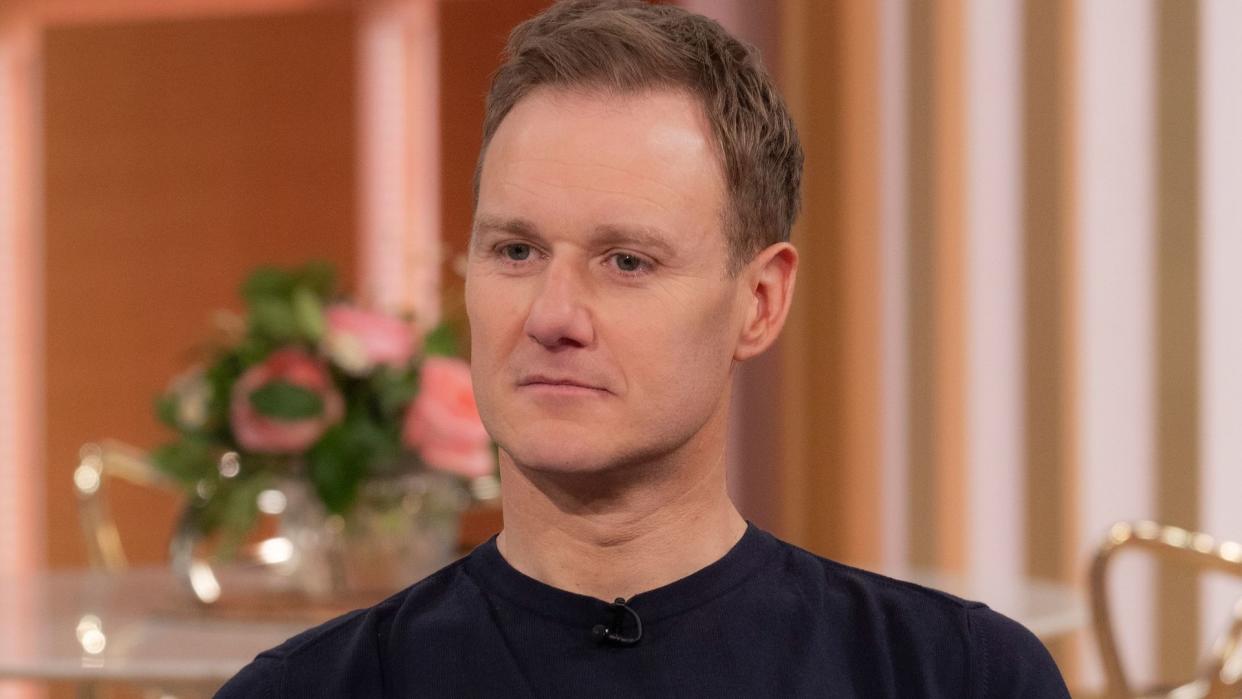 Dan Walker in a black T-shirt and trousers 