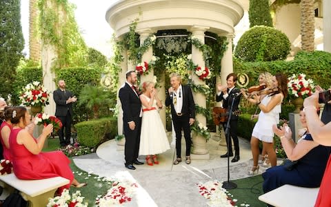 Sir Rod Stewart (R) sings during the wedding of Sharon Cook (C) and Andrew Aitchison - Credit: Denise Truscello