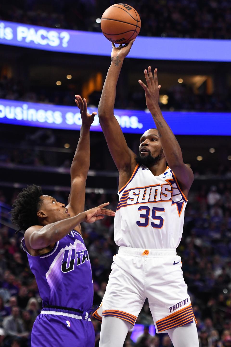 SALT LAKE CITY, UTAH - NOVEMBER 17: Kevin Durant #35 of the Phoenix Suns shoots over Collin Sexton #2 of the Utah Jazz during the first half of an NBA In-Season Tournament game at Delta Center on November 17, 2023 in Salt Lake City, Utah.