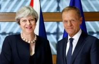 British Prime Minister Theresa May and European Council President Donald Tusk pose during a EU leaders summit in Brussels, Belgium June 22, 2017. REUTERS/Francois Lenoir