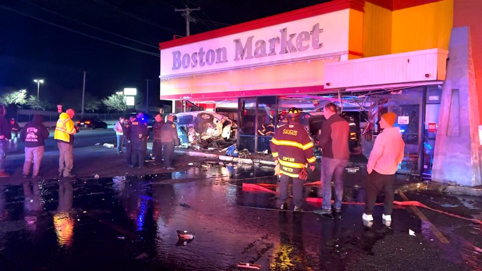 Two cars flipped and crashed into the storefront of former Boston Market in a dramatic accident after a moving vehicle collided with a parked car in Saugus, Massachusetts.