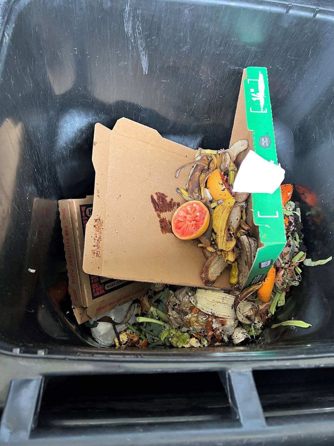 At the Cary food waste drop-off, residents can dump their old pizza boxes, egg shells, raw or cooked fruits, vegetables, paper plates and paper towels or napkins and more into assorted bins for compost.