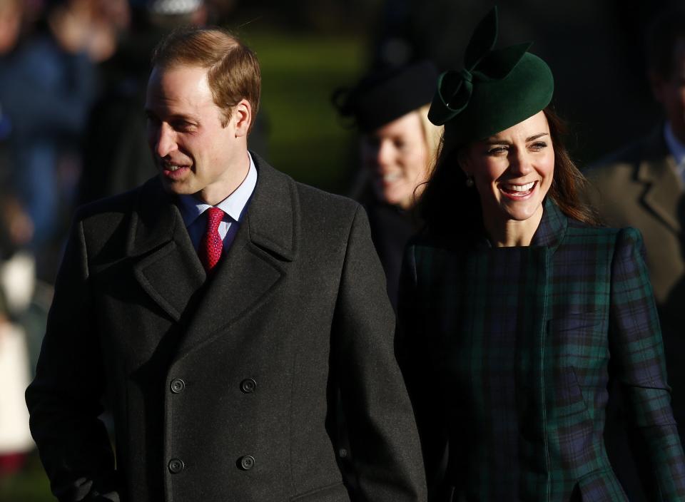 Britain's Prince William and Catherine, the Duchess of Cambridge, walk to a Christmas Day morning service at the church on the Sandringham Estate in Norfolk, eastern England, December 25, 2013. REUTERS/Andrew Winning (BRITAIN - Tags: ROYALS RELIGION)