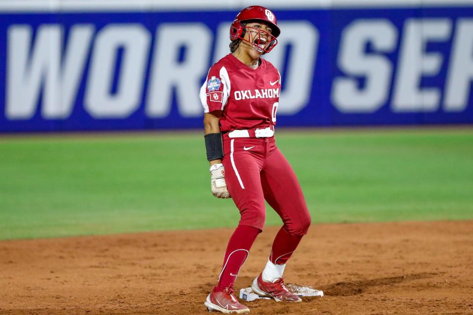 Oklahoma outfielder Rylie Boone (0) celebrates after hitting a double to the wall in the fouth inning during the first game of the Women's College World Series finals between Oklahoma (OU) and Florida State at USA Softball Hall of Fame Stadium in Oklahoma City on Wednesday, June 7, 2023.
