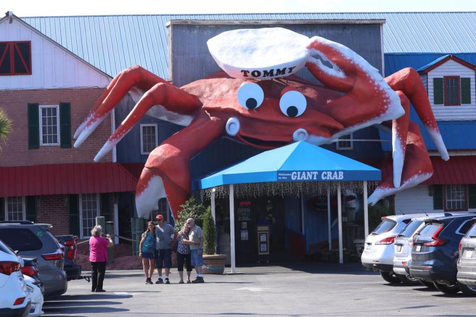 Fran Kohne takes a photo of Missouri family members after dining at The Giant Crab Gourmet Seafood Buffet.