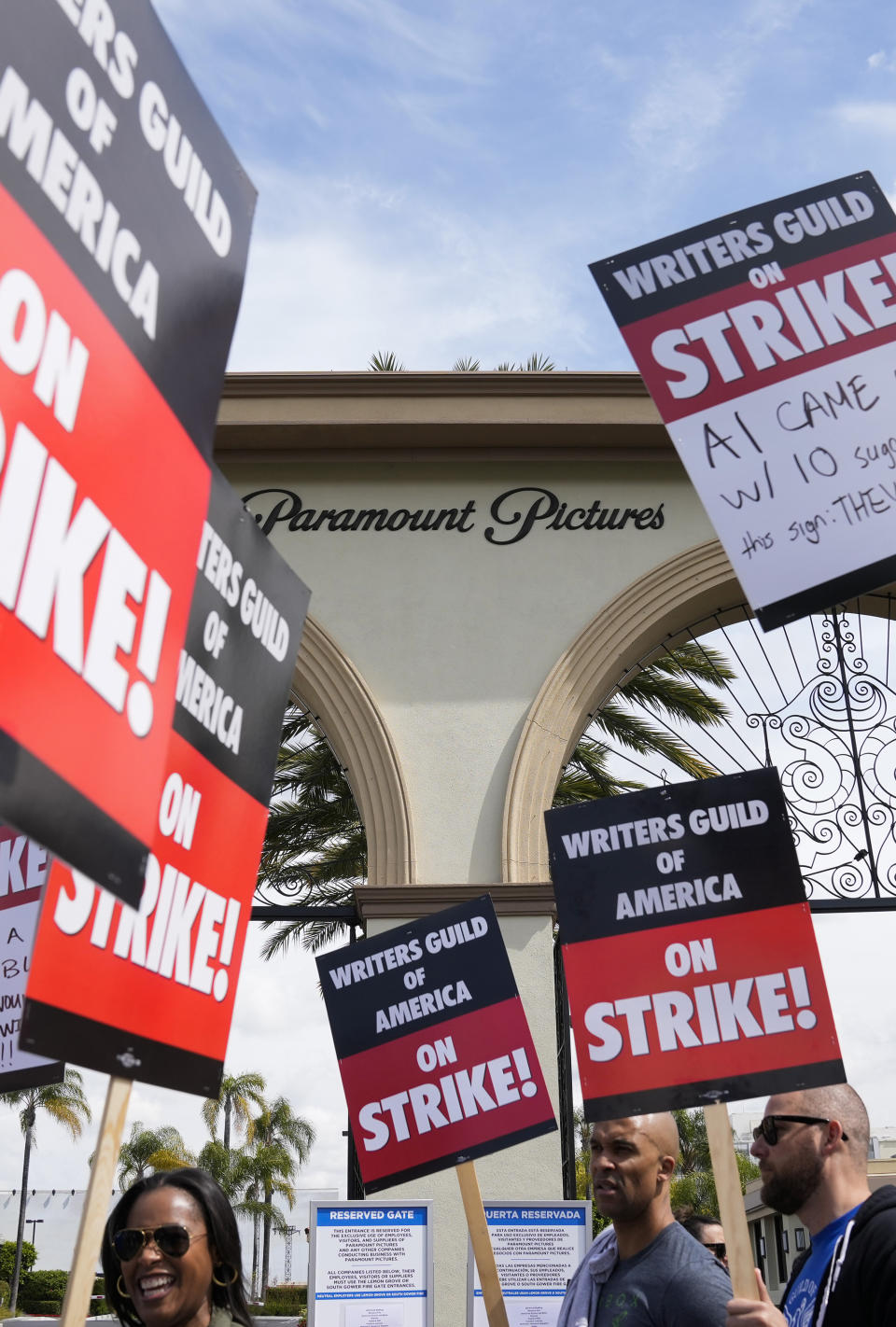 FILE - Members of the The Writers Guild of America picket outside Paramount Pictures in Los Angeles on May 3, 2023. Hollywood actors may be on the verge of joining screenwriters in what would be the first two-union strike in the industry in more than six decades. (AP Photo/Ashley Landis, File)