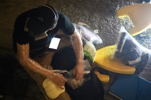 Activists wrapped cling film around their arms and thick bandages around their knees