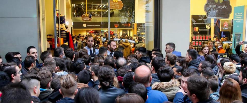 People wait outside a department store on Black Friday in Thessaloniki, Greece