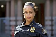 In this Aug. 5, 2019, photo, Portland Police Chief Danielle Outlaw poses for a photo in Portland, Ore. "I don’t want for one minute anyone to think that because we’re being thrust into this political show, that I or the public have lost confidence in (police officers') ability to do what we do," said Police Chief Danielle Outlaw, who is regularly heckled as she leaves City Hall by those who feel the police target counterprotesters for arrest over far-right demonstrators. (AP Photo/Craig Mitchelldyer)