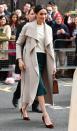 <p>For a visit to Northern Ireland, Markle sported a greige Mackage wrap coat over her ivory sweater and emerald Greta Constantine skirt. </p>