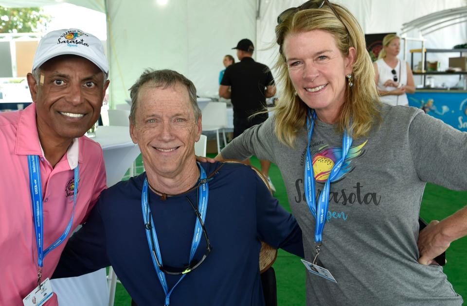 Committee member Cliff Menezes with Bruce Flory the tournament director and a tournament sponsor Elizabeth Moore. Sarasota's Elizabeth Moore Sarasota Open ATP Challenger tennis tournament in downtown Sarasota concludes Sunday.