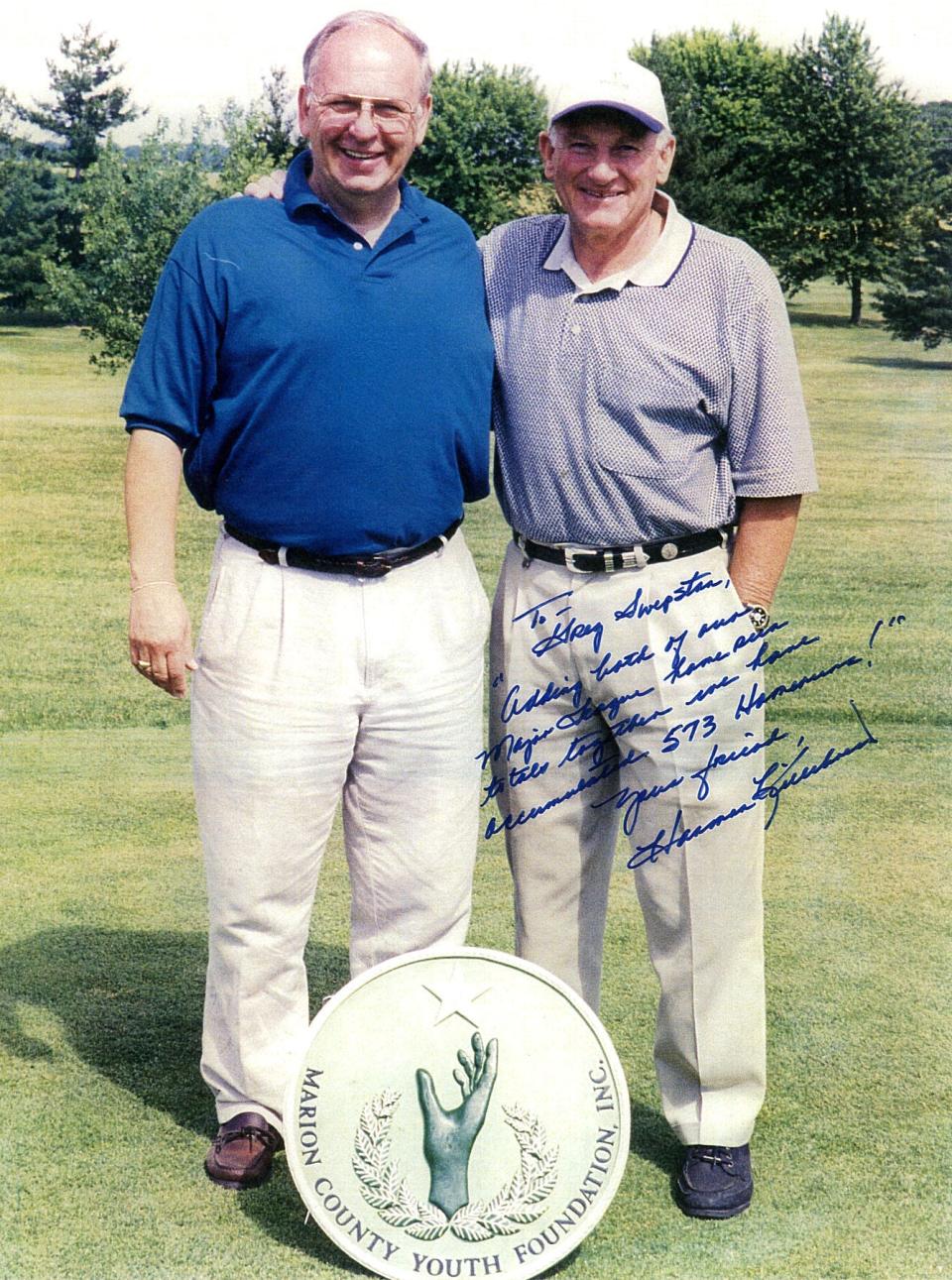 Greg Swepston, left, is pictured with Major League Baseball Hall of Fame member Harmon Killebrew one year at the Marion County Youth Foundation's Charity Celebrity Golf Outing fundraiser. The inscription to him on this picture reads, "Adding both our Major League home run totals together, we have accumulated 573 homeruns!" Besides being a coach, teacher and administrator at Marion Harding, Swepston worked for decades as a pro baseball scout.