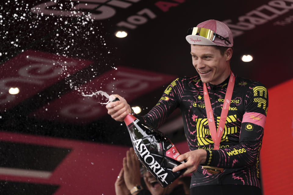 Georg Steinhauser celebrates on podium after winning the 17th stage of the Giro d'Italia from Selva di Val Gardena to Passo Brocon, Italy, Wednesday, May 22, 2024. (Marco Alpozzi/LaPresse via AP)