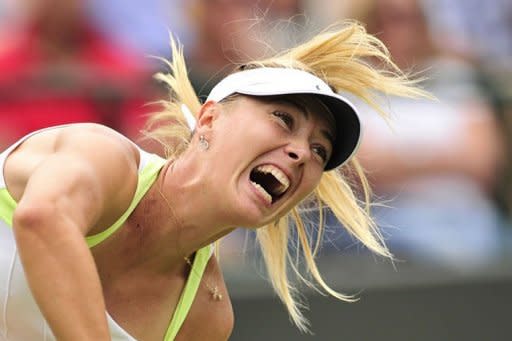 Russia's Maria Sharapova serves during her second round women's singles victory over Bulgaria's Tsvetana Pironkova on day four of the 2012 Wimbledon Championships tennis tournament at the All England Tennis Club in Wimbledon, southwest London