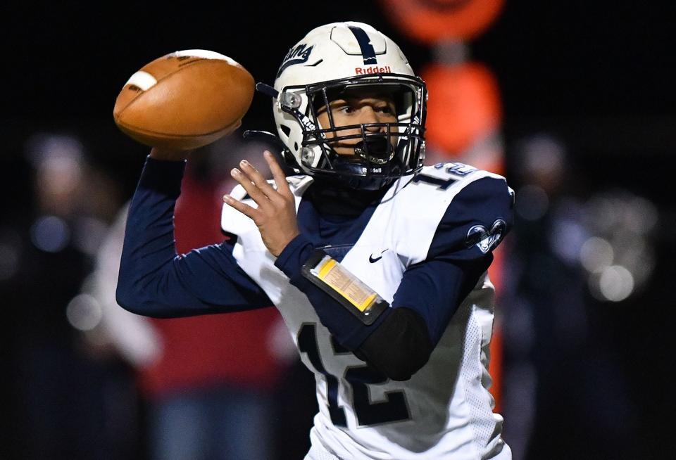 Rochester's Jayden Norman looks for an open receiver during a class 1A WPIAL playoff game against Union Friday night at Freedom Area High School.