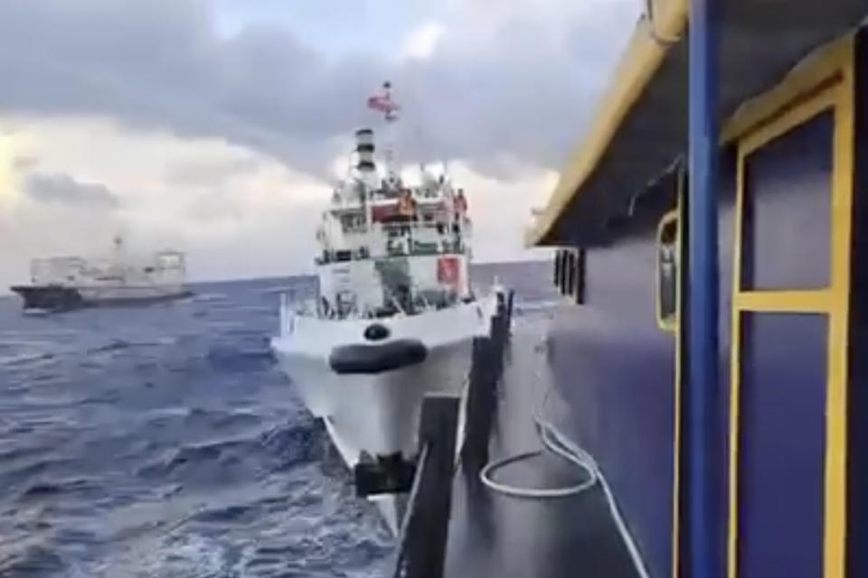 In this image made from video handout provided by the Philippine Coast Guard, a Chinese Coast Guard ship rams the Philippine navy-operated supply boat Unaizah Mae 1 as it approaches Second Thomas Shoal, locally known as Ayungin Shoal, in the disputed South China Sea on Sunday Dec. 10, 2023. The Chinese coast guard targeted Philippine vessels with water cannon blasts Sunday and rammed one of them, causing damage and endangering Filipino crew members off a disputed shoal in the South China Sea, just a day after similar hostilities at another contested shoal, Philippine officials said. (Philippine Coast Guard via AP)