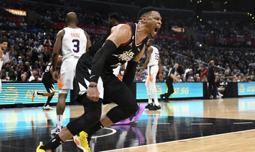 LOS ANGELES, CA -APRIL 22, 2023: LA Clippers guard Russell Westbrook (0) reacts after a breakaway slam dunk against the Phoenix Suns in Game 4 of the first round NBA playoffs at Crypto.com Arena on April 22, 2023 in Los Angeles, California. His game high 37 points weren't enough in the 100-112 loss to the Suns.(Gina Ferazzi / Los Angeles Times)