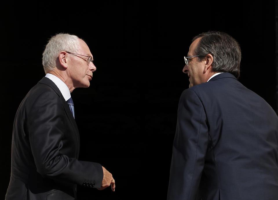 Greek prime minister Antonis Samaras, right, welcomes European Council president Herman Van Rompuy prior to their meeting in Athens, Friday, Sept. 7, 2012. Greece is struggling to meet budget commitments needed for continued emergency financing from eurozone countries and the International Monetary Fund. (AP Photo/Petros Giannakouris)