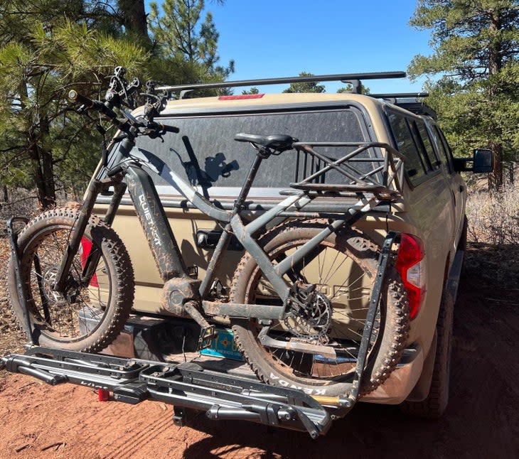 An e-bike loaded on a rack on the back of a truck