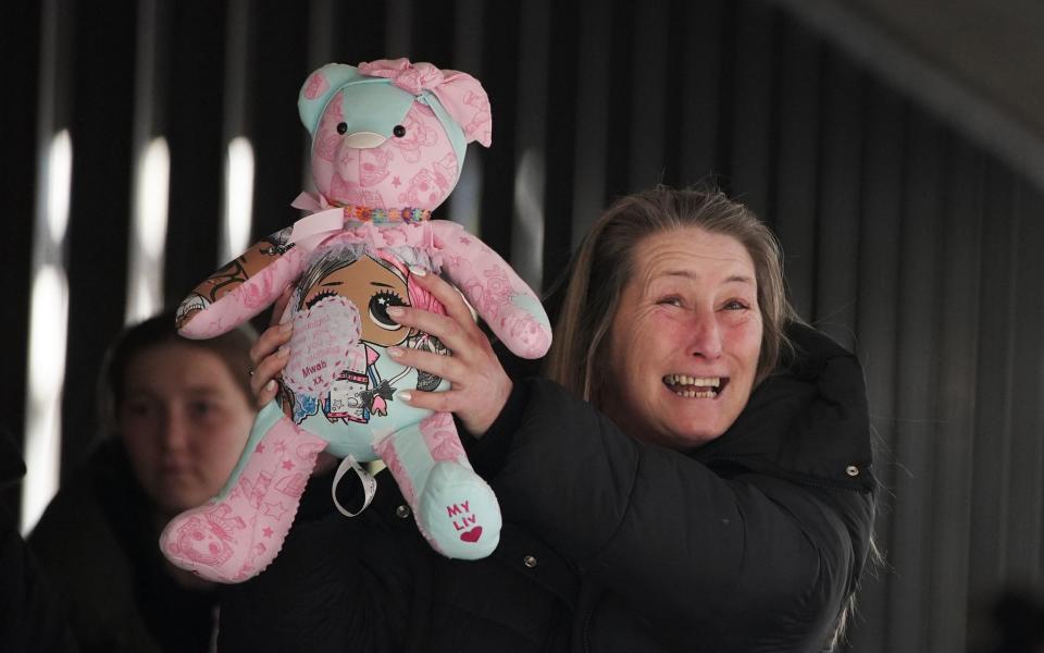 Cheryl Korbel left court carrying one of her daughter's favourite soft toys - PA