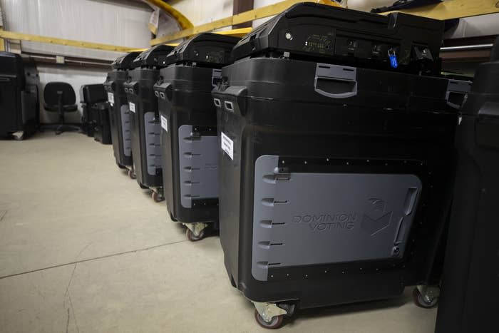 Dominion Voting Systems ballot counting machines are lined up at a warehouse during testing of election equipment in Estancia, New Mexico, on Sept. 29, 2022. 