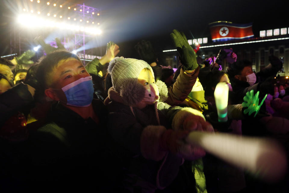 Citizens enjoy the New Year's performance on Kim Il Sung Square in Pyongyang, North Korea, Saturday, Jan. 1, 2022. (AP Photo/Cha Song Ho)