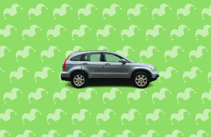 A small SUV against a green background