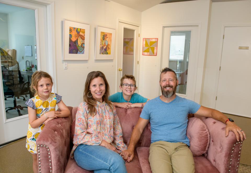 Ben and Katie VandenBerg sit with their kids Genevieve, 6, and Finn, 11, in the family's new business venture, Muse, a co-working space that also serves as an art gallery, photography studio and Ben's workshop at 71 E. Queenwood Road in Morton.