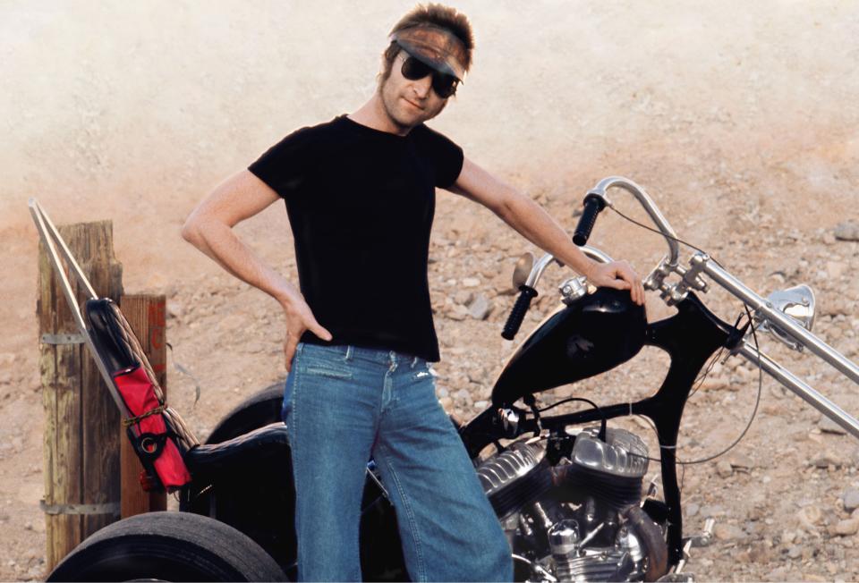 John Lennon on a motorcycle. The photo was taken by May Pang during an 18-month period in which the two were romantically involved known as the "Lost Weekend."