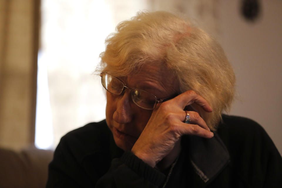 Kim Mincks reacts inside her home in Gonzalez, La., Sunday, Jan. 27, 2019, where two of her housemates, Keith Theriot and his wife Elizabeth Theriot, were killed in another room yesterday while she slept. (AP Photo/Gerald Herbert)