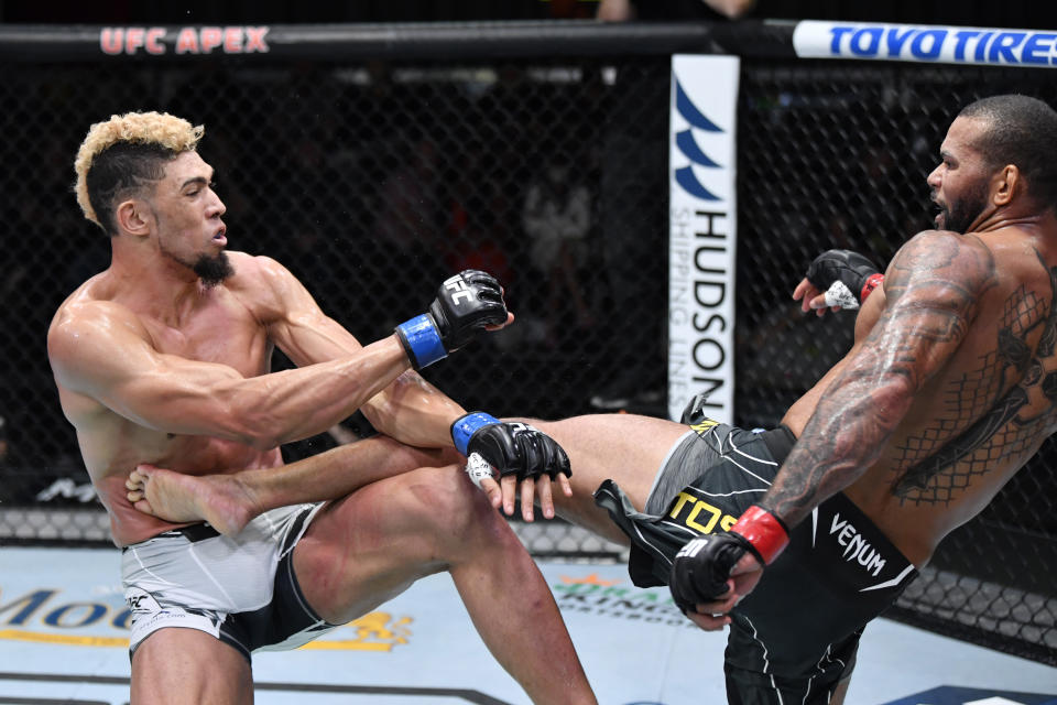 LAS VEGAS, NEVADA - OCTOBER 02:  (R-L) Thiago Santos of Brazil kicks Johnny Walker of Brazil in their light heavyweight bout during the UFC Fight Night event at UFC APEX on October 02, 2021 in Las Vegas, Nevada. (Photo by Jeff Bottari/Zuffa LLC)