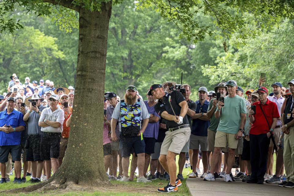 Talor Gooch of RangeGoats GC hits a shot on the ninth hole during the first round of LIV golf tournament at the Cedar Ridge Country Club, Friday, May 12, 2023, in Broken Arrow, Okla. (Charles Laberge/LIV Golf via AP)