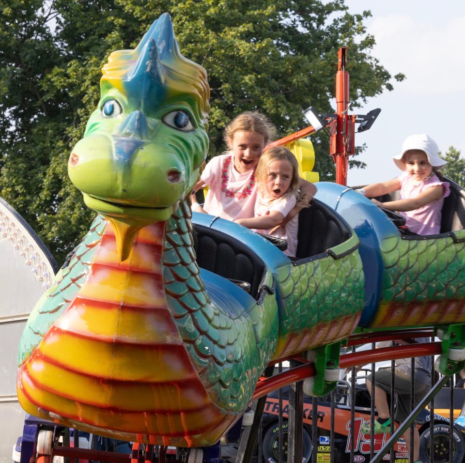 Children enjoy a dragon coaster at the Monmouth County Fair.