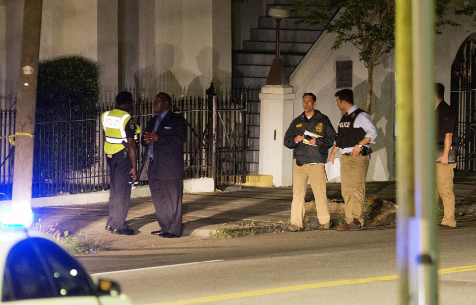 Police stand outside the Emanuel AME Church following the shooting. (AP Photo/David Goldman)