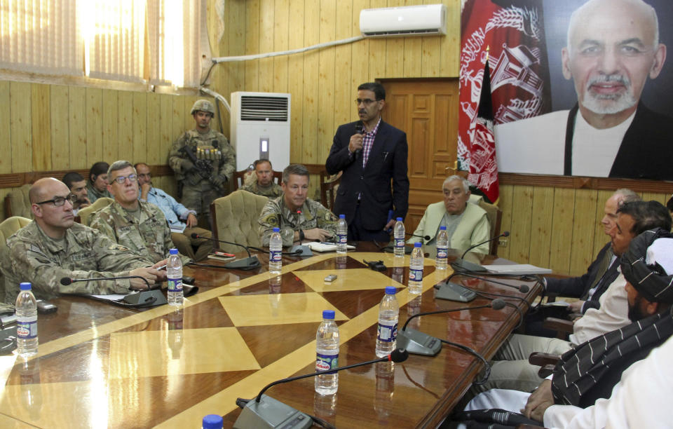 The head of NATO troops in Afghanistan, Gen. Scott Miller, center left, Kandahar Gov. Zalmay Wesa, center right, and their delegations attend a security conference, in Kandahar, Afghanistan, Thursday, Oct. 18, 2018. The three top officials in Afghanistan's Kandahar province were killed, including Wesa, when their own guards opened fire on them at the conference Thursday, the deputy provincial governor said. A Taliban spokesman said the target was Miller, who escaped without injury, according to NATO. (AP Photo)