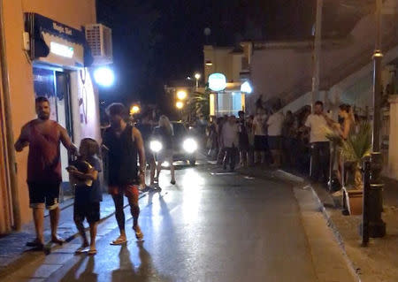 People walk on a street after an earthquake hit the island of Ischia, off the coast of Naples, Italy August 21, 2017. MANDATORY CREDIT @totoriellos/Handout via Reuters