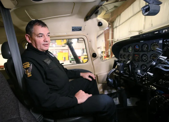 Milan Milosevic, aviation trooper with the Ohio State Highway Patrol, sits in the cockpit of his Cessna 182 Skylane.