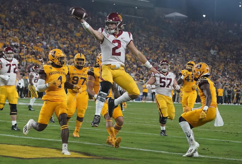 USC quarterback Jaxson Dart celebrates after running for a touchdown against Arizona State
