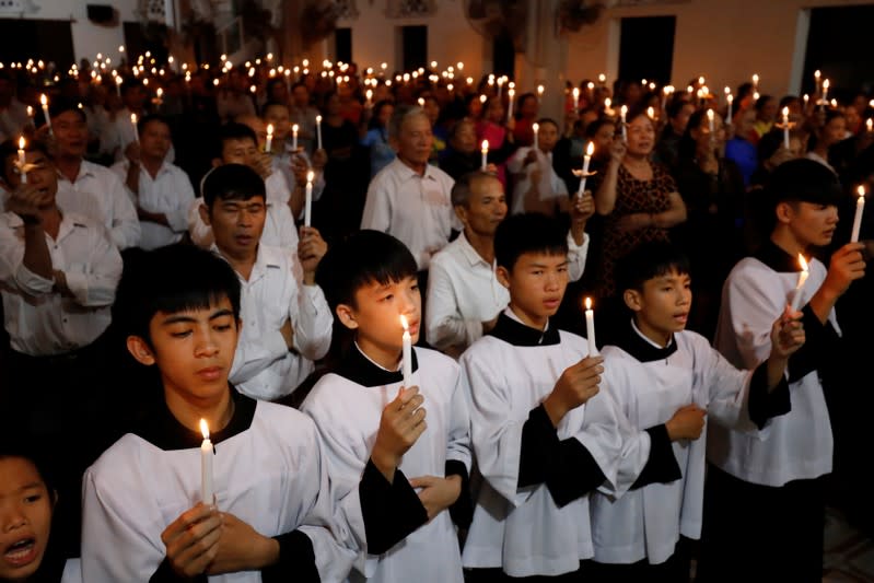 Catholics attend a mass prayer for 39 people found dead in the back of a truck near London, UK at My Khanh parish in Nghe An province