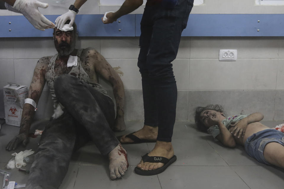 Wounded Palestinians receive treatment at the al-Shifa hospital, following Israeli airstrikes on Gaza City, central Gaza Strip, Monday, Oct. 23, 2023. (AP Photo/Abed Khaled)