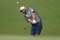 Dustin Johnson chips onto the ninth green during a practice round prior to the Tournament of Champions golf event, Wednesday, Jan. 6, 2021, at Kapalua Plantation Course in Kapalua, Hawaii. (AP Photo/Matt York)