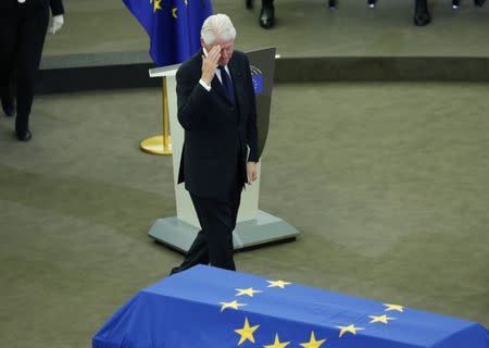 Former U.S. President Bill Clinton salutes as he walks past the coffin of late former German Chancellor Helmut Kohl during of a memorial ceremony at the European Parliament in Strasbourg, France, July 1, 2017. REUTERS/Francois Lenoir