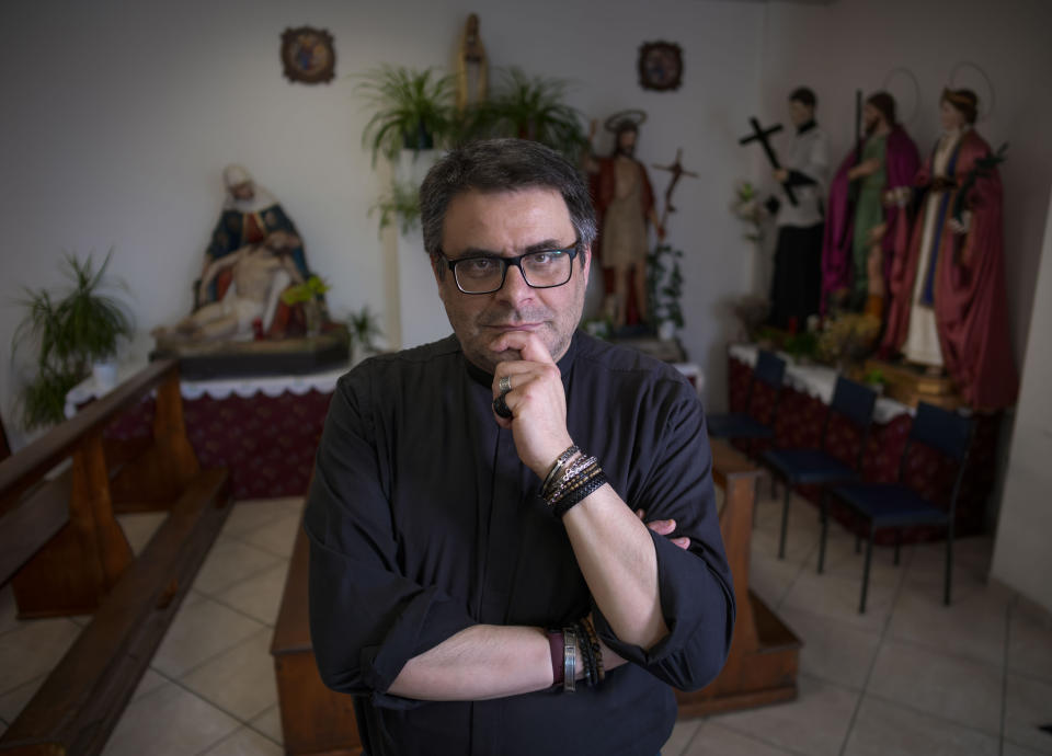 The Rev. Giovanni Mandozzi, parish priest in Isola del Gran Sasso near Teramo in central Italy poses for portraits Saturday, June 3, 2023. “I tell them, ‘I do Mass in under 40 minutes, you can leave your pasta sauce on the stove, and it won’t even stick to the bottom of the pot.’” (AP Photo/Domenico Stinellis)