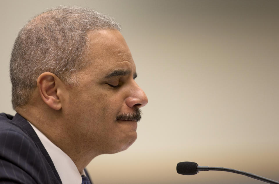 Attorney General Eric Holder pauses as he testifies on Capitol Hill in Washington, Wednesday, May 15, 2013, before the House Judiciary Committee oversight hearing on the Justice Department. Holder is expected to face aggressive questioning on topics ranging from the Justice Department's gathering of phone records at the Associated Press to the government's handling of intelligence before the Boston Marathon bombings. (AP Photo/Carolyn Kaster)