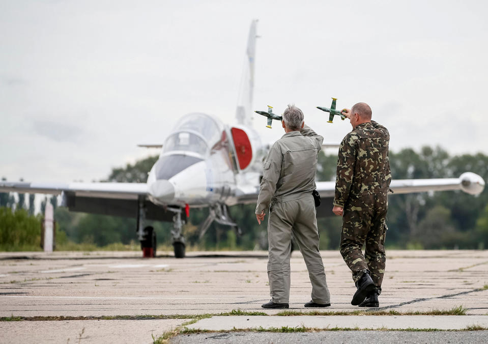 Pilots plan a flight manoeuvre with model aircraft at a military air base in Vasylkiv