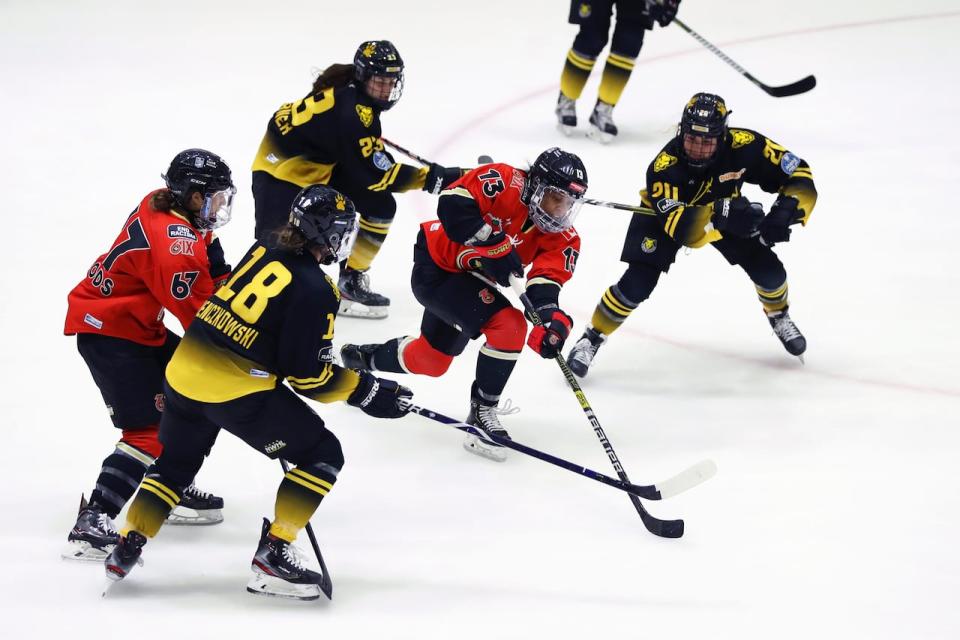 Former PHF MVP Mikyla Grant-Mentis, centre, told CBC Sports that she has received very little information about the new unified women's pro hockey league. (Maddie Meyer/Getty Images - image credit)