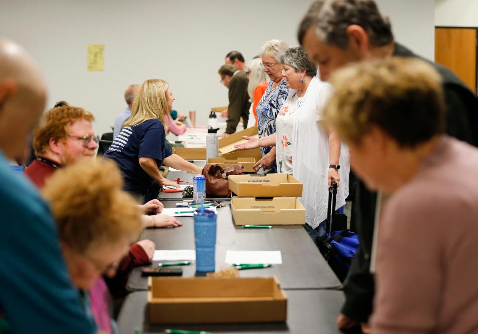 Greene County election workers work in bipartisan pairs as ballots return from polling places around the county on Tuesday, April 4, 2023.